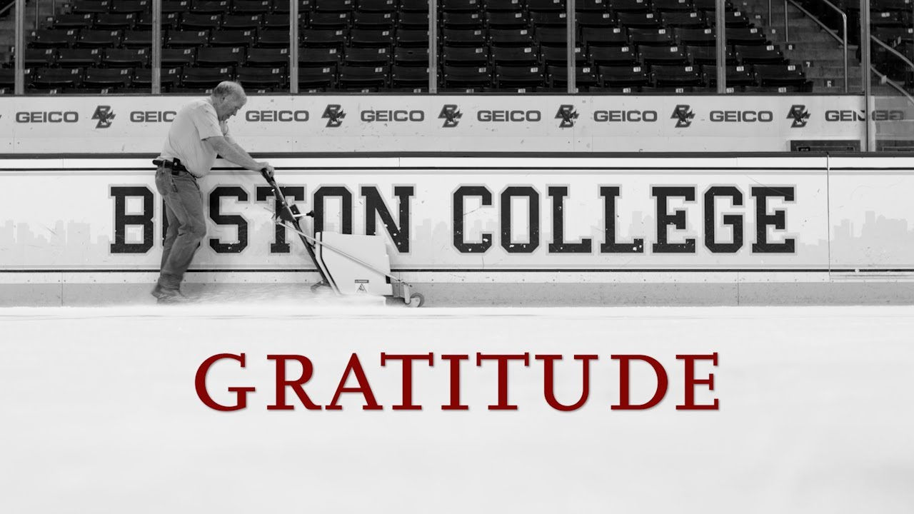 Man cleaning the ice; Gratitude in maroon writing