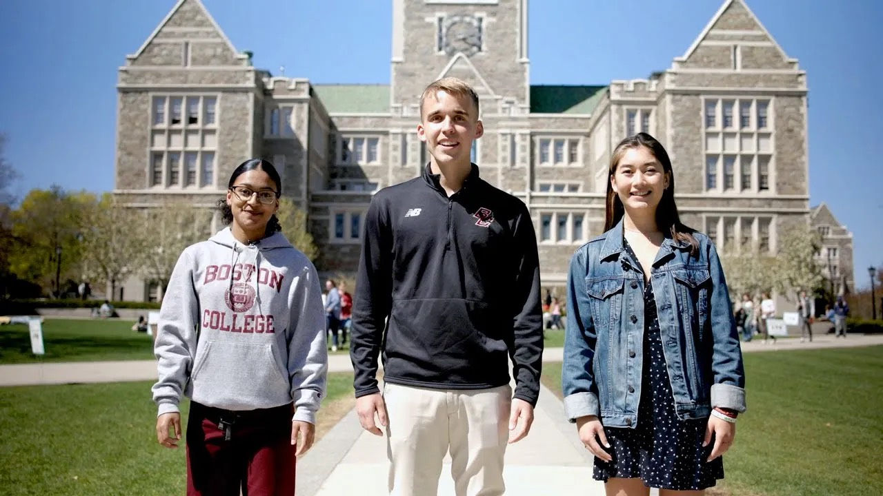 Three students in front of Gasson Hall
